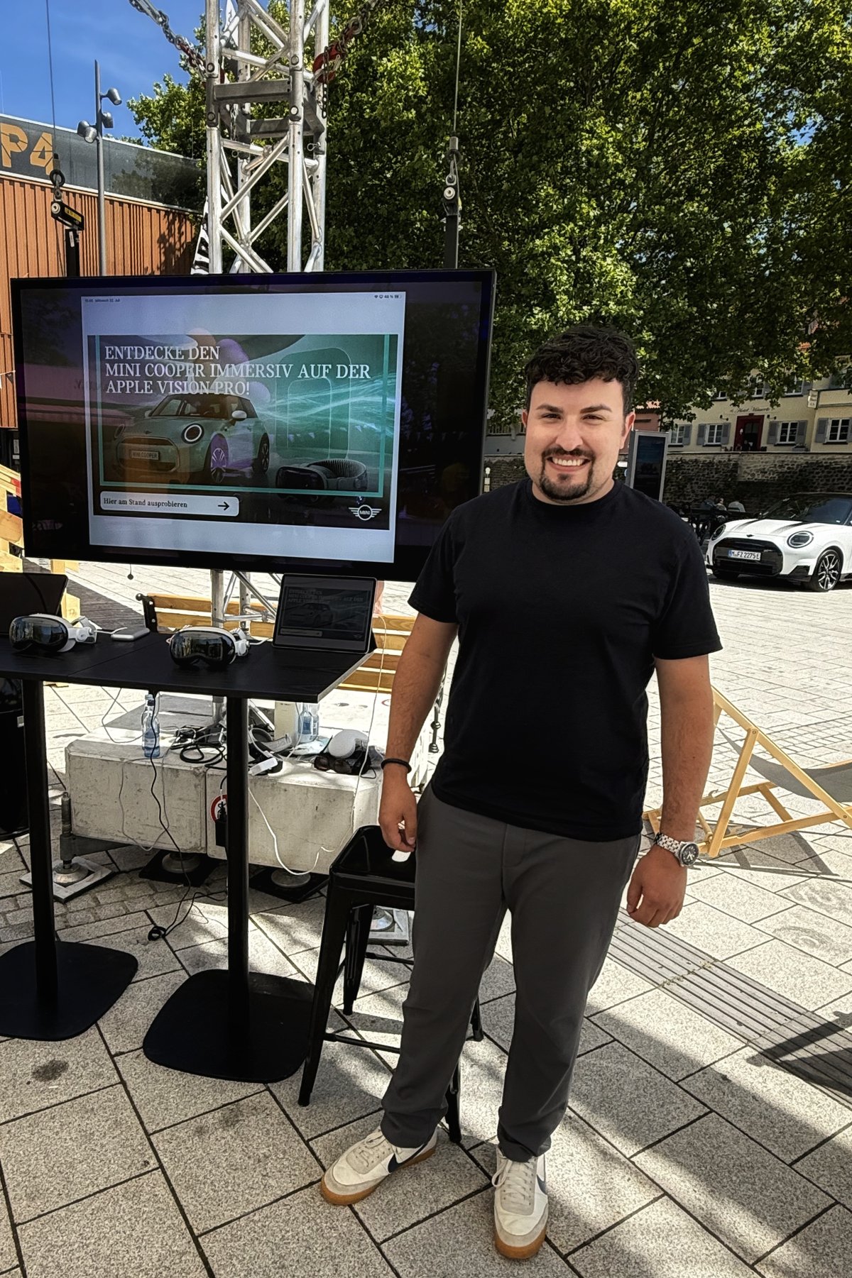 Philip smiling beside a MINI immersive demo display.